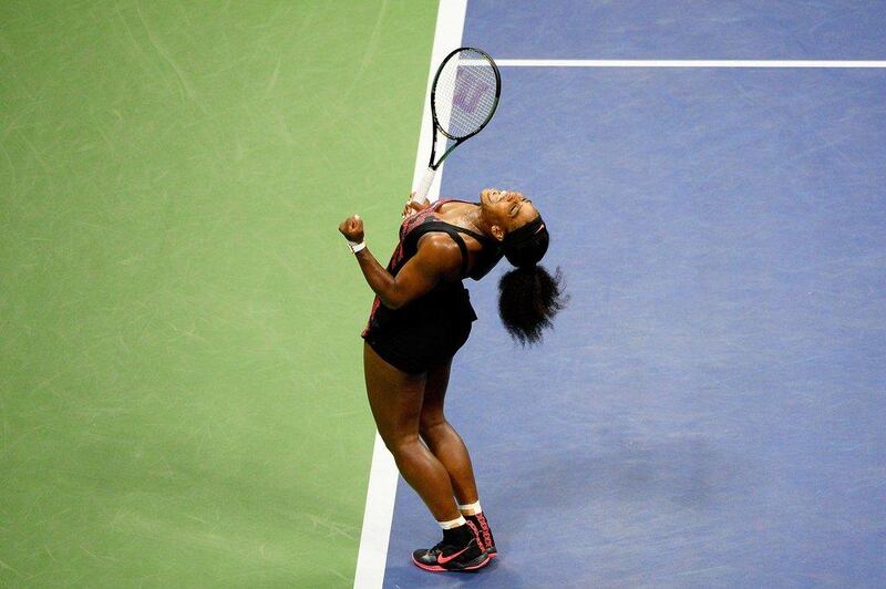 Serena Williams celebrates victory over sister Venus in their quarter-final contest at the US Open on Tuesday in New York City. Alex Goodlett / Getty Images / AFP