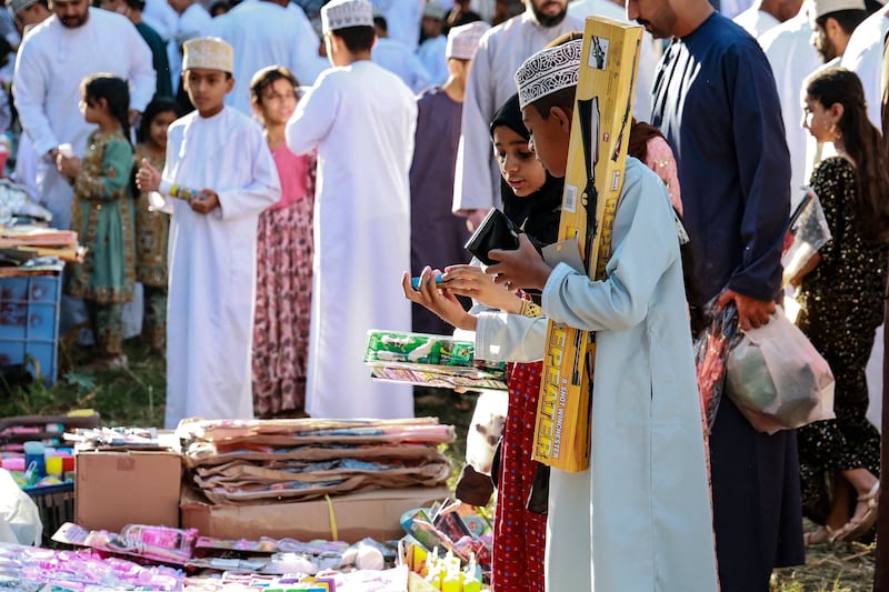 Children choose gifts ahead of Eid Al Fitr celebrations, at a market in the Sarur area of Oman's Samail governorate. AFP