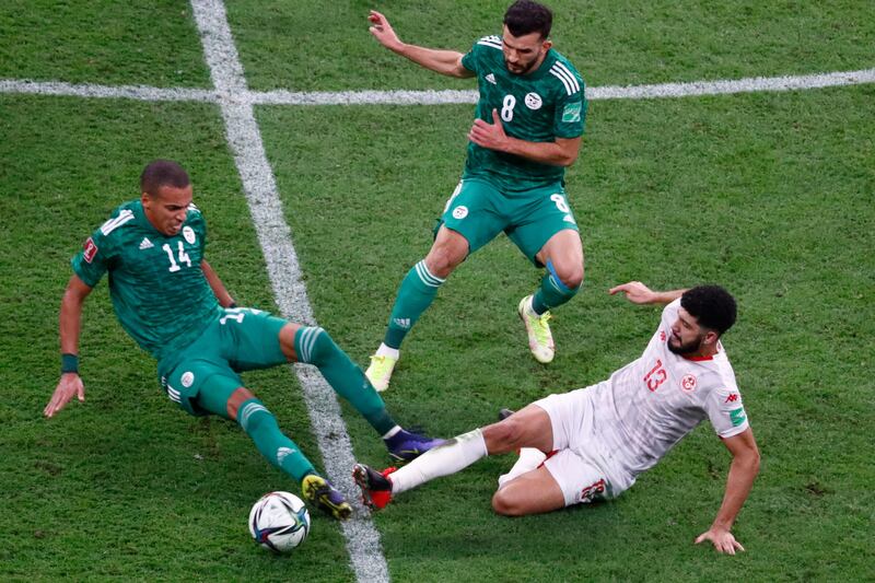 Algeria's Sofiane Bendebka fouls Ferjani Sassi of Tunisia. AFP