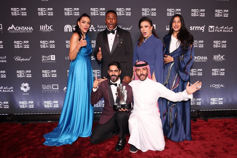 Obaid Alwadaani and Ra’ed Alshammari with the cast and crew with the Red Sea Competition jury prize for for Within Sand