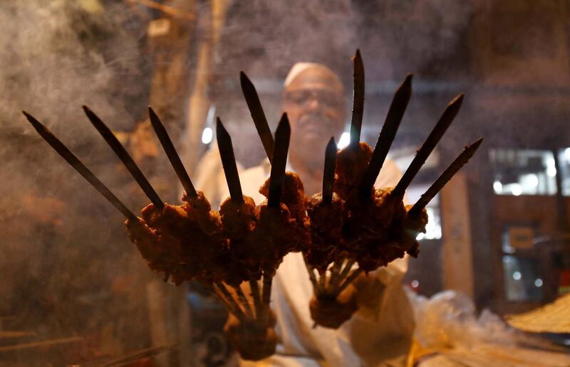 A man prepares grilled meat in Karachi, Pakistan.  EPA