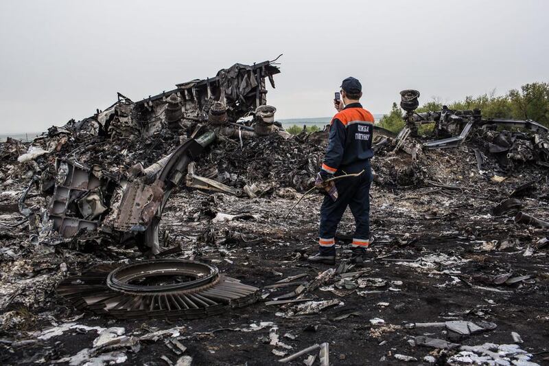 Readers pray for the victims and seek answers about the fate of flight MH17. Brendan Hoffman / Getty Images

