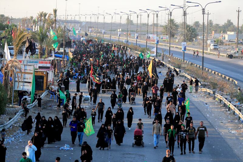 Shi'ite Muslim pilgrims walk to the holy city of Kerbala, ahead of the holy Shi'ite ritual of Arbaeen in Baghdad, Iraq.  REUTERS