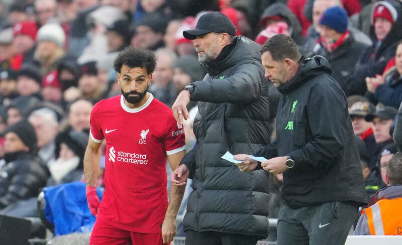 Liverpool's manager Jurgen Klopp gives instructions to Mohamed Salah before sending him on as a substitute. AP 