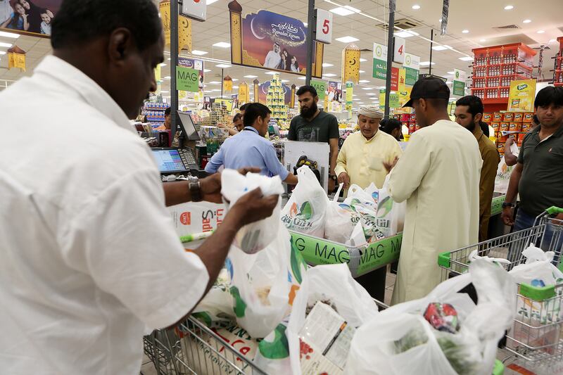 The queues at supermarkets, such as Sharjah Cooperative Society, were four times longer than usual. Pawan Singh / The National  