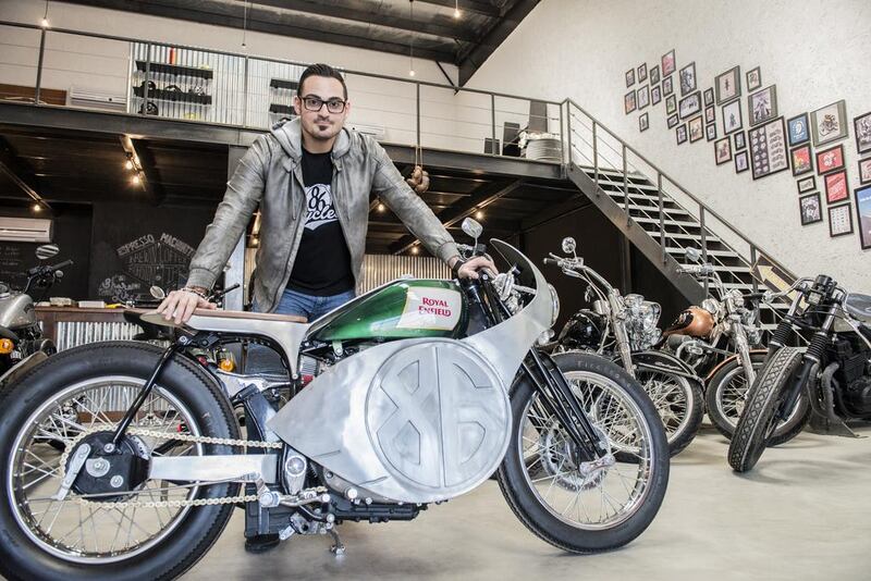 Zeid Salman, one of two brothers who run 86 Cycles, with his favourite Royal Enfield motorbike at the company’s workshop in Abu Dhabi. Vidhyaa for the National