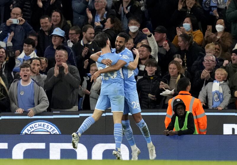 Riyad Mahrez celebrates with Bernardo Silva after putting Manchester City ahead. EPA