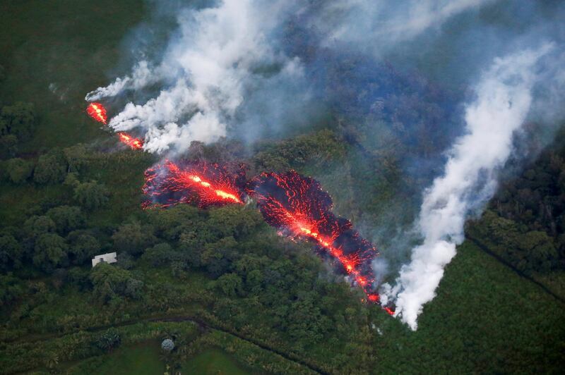 Lava erupts from a fissure east of the Leilani Estates subdivision during ongoing eruptions of the Kilauea Volcano in Hawaii on May 13, 2018. Terray Sylvester / Reuters