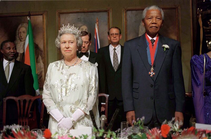 Queen Elizabeth with Nelson Mandela at a banquet in Cape Town, South Africa, in 1995. Getty