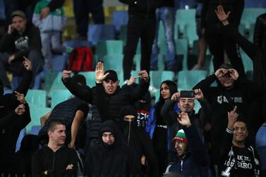 Bulgaria fans gesture in the stands after being warned over the tannoy about their behaviour during the match against England in Sofia. PA
