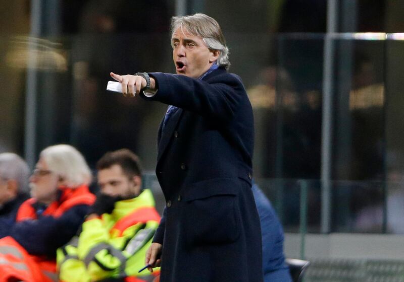 FILE - In this March 12, 2016 file photo Inter Milan coach Roberto Mancini gives instructions during the Serie A soccer match between Inter Milan and Bologna at the San Siro stadium in Milan, Italy. The Italian soccer federation has talked to Roberto Mancini about the possibility of becoming the next coach of the national team. The 53-year-old Mancini, who has coached Manchester City and Inter Milan, is among several candidates for the role â€” along with current Chelsea coach Antonio Conte, Carlo Ancelotti and Claudio Ranieri. (AP Photo/Antonio Calanni)