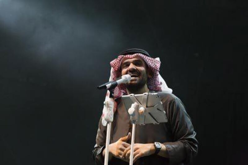 Hussein Al Jasmi's kandura was soaked through as he performed in the rain at the closing concert of the du World Music Festival in Dubai last night. Duncan Chard for the National