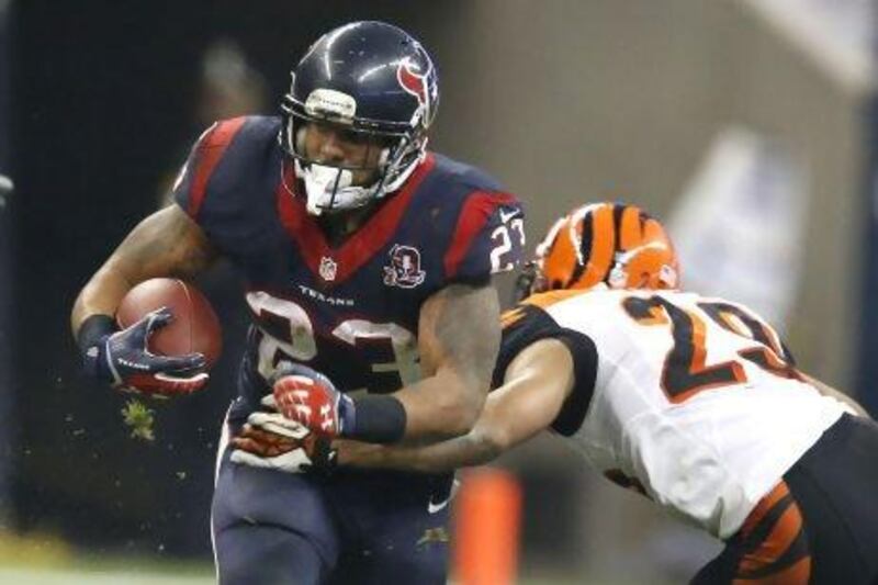 Arian Foster, left, of the Houston Texans is not your typical NFL running back. He keeps a journal with poems and short stories he has written. During a bye week he visited the Occupy Wall Street protest in New York. And he's a vegetarian.