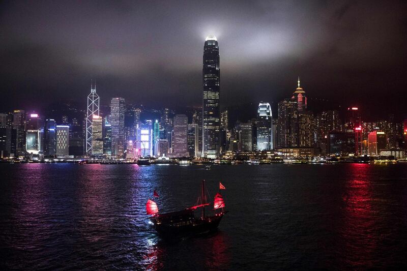 A tourist junk boat sails in Victoria Harbour before the Earth Hour environmental campaign in Hong Kong on March 30, 2019.  The 13th edition of Earth Hour, organised by the green group WWF, will see millions of people across 180 countries turn off their lights at 8:30 pm local time to highlight energy use and the need for conservation. / AFP / Dale DE LA REY
