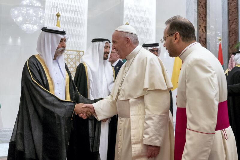 ABU DHABI, UNITED ARAB EMIRATES - February 3, 2019: Day one of the UAE papal visit - HH Sheikh Nahyan bin Mubarak Al Nahyan, UAE Minister of State for Tolerance (L) greets His Holiness Pope Francis, Head of the Catholic Church (2nd R), during his arrival at the Presidential Airport. 
( Mohamed Al Hammadi / Ministry of Presidential Affairs )
---