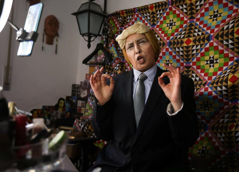 Alaa Bliha, a Jordanian artist using make-up to transform into celebrities, records a video as she imitates U.S. President Donald Trump, at her home in Amman, Jordan December 29, 2020. Picture taken December 29, 2020. REUTERS/Muhammad Hamed