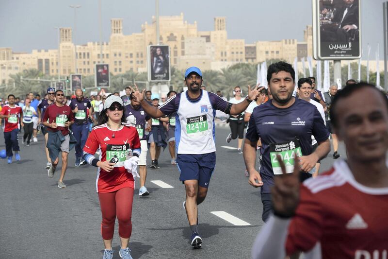 Dubai, United Arab Emirates - January 25, 2019: People run in the 10k at the Standard Chartered Dubai Marathon 2019. Friday, January 25th, 2019 at Jumeirah, Dubai. Chris Whiteoak/The National