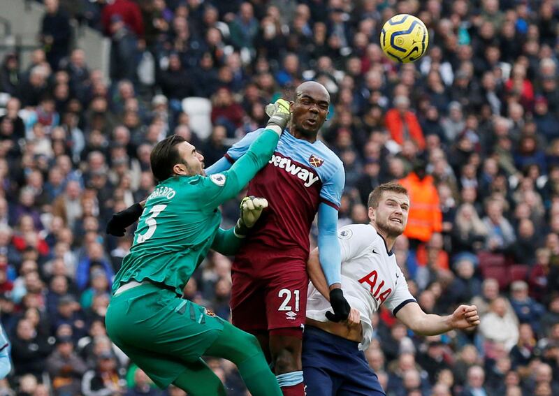Tottenham Hotspur's Eric Dier in action with West Ham United's Roberto and Angelo Ogbonna. Reuters