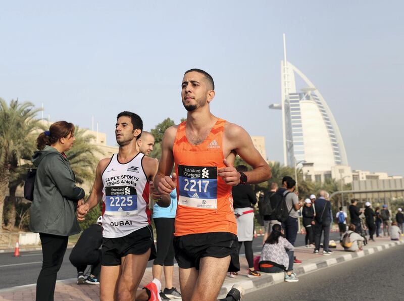 Dubai, United Arab Emirates - January 25, 2019: People run in the Standard Chartered Dubai Marathon 2019. Friday, January 25th, 2019 at Jumeirah, Dubai. Chris Whiteoak/The National