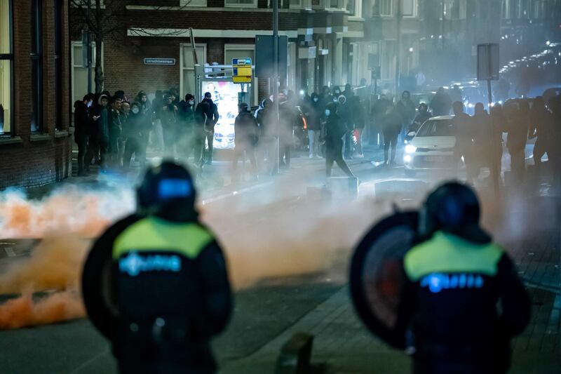 A large group of young people pelts the police with stones and fireworks on Beijerlandselaan in Rotterdam. EPA