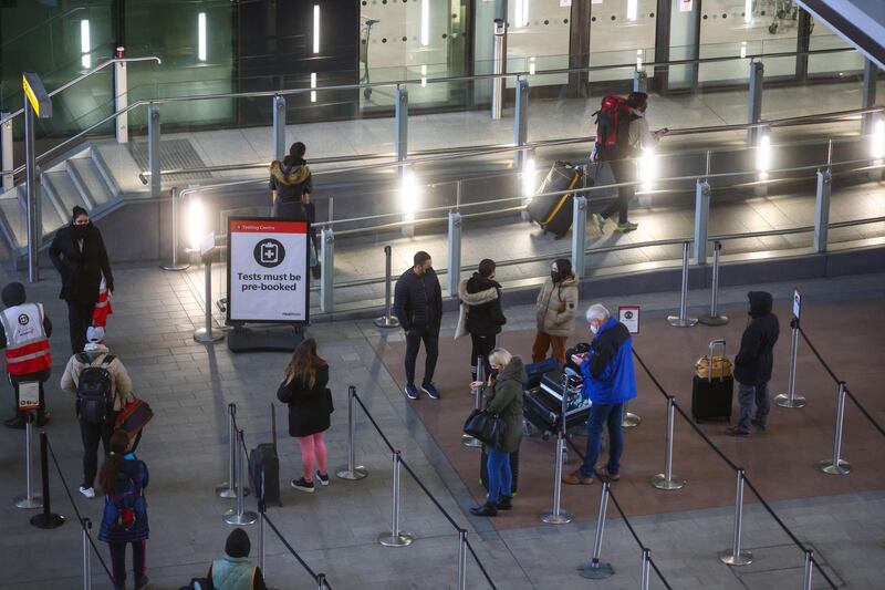 Travelers stand in line for their tests on arrival Heathrow Airport. Bloomberg