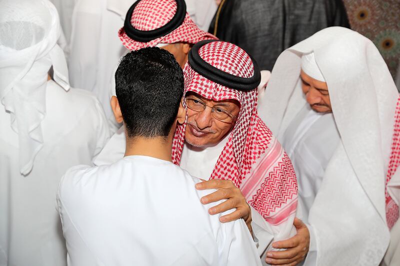 Muslims greet each other on the first day of Eid at Al Farooq Omar bin Al Khattab Mosque