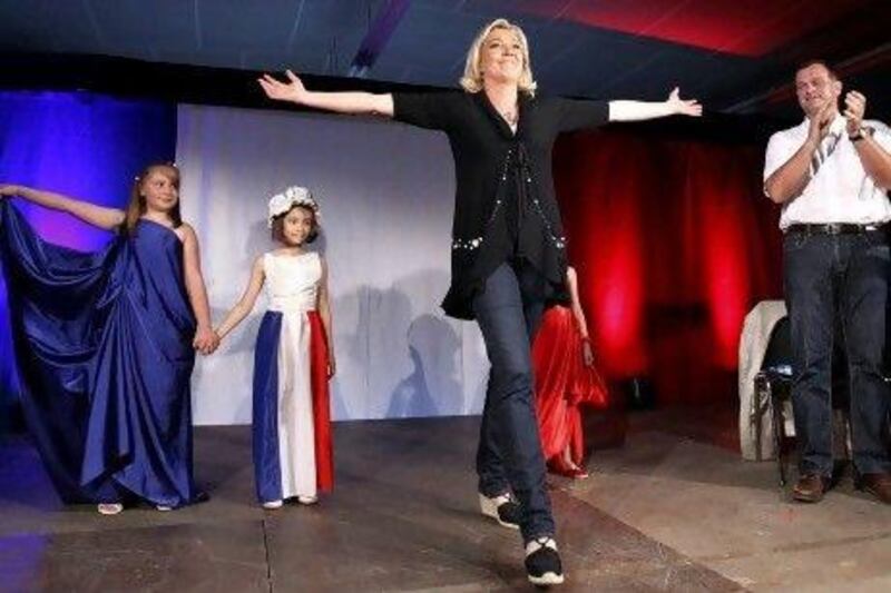 Marine Le Pen and her husband Louis Alliot campaign during a political rally in southern France on Wednesday.