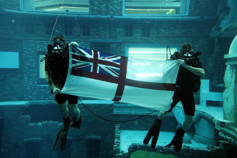 Royal Navy ship divers try out the new Deep Dive Dubai pool.