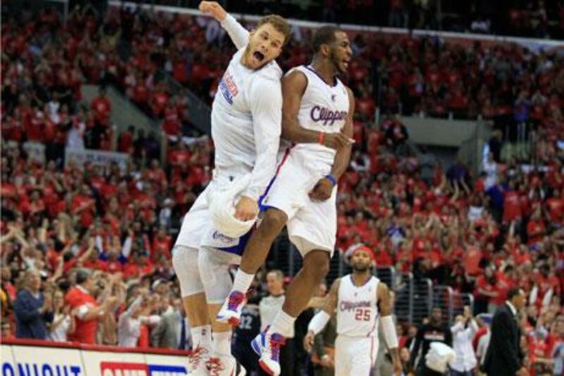 Blake Griffin, left, and Chris Paul celebrate the Los Angeles Cippers victory over the Memphis Grizzlies.