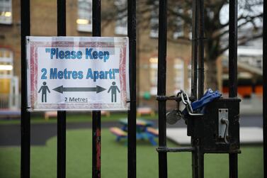 A social distancing sign hangs on a primary school gate in London, England. Getty