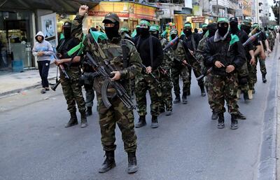 Fighters from Hamas's military wing, the Ezzedine Al Qassam Brigades, in 2021. Hamas does not share ISIS's ideological views. AP