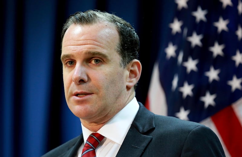 FILE - In this June 7, 2017, file photo, Brett McGurk, the U.S. envoy for the global coalition against IS, speaks during a news conference at the U.S. Embassy Baghdad, Iraq. The Trump administration will keep open the State Department unit overseeing the fight against the Islamic State group for at least six more months, reversing a plan for its imminent downgrade even as President Donald Trump pushes ahead with moves for a speedy U.S. exit from Syria. McGurk, is now expected to remain in his job at least through the end of the year. (AP Photo/Hadi Mizban, File)