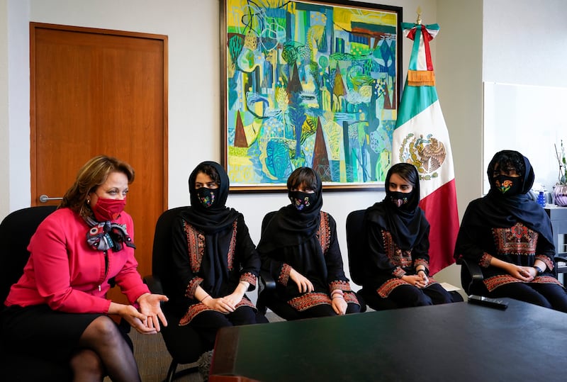 Martha Delgado, undersecretary for Multilateral Affairs and Human Rights at the Ministry of Foreign Relations of Mexico, welcomes the girls to Mexico City. AP