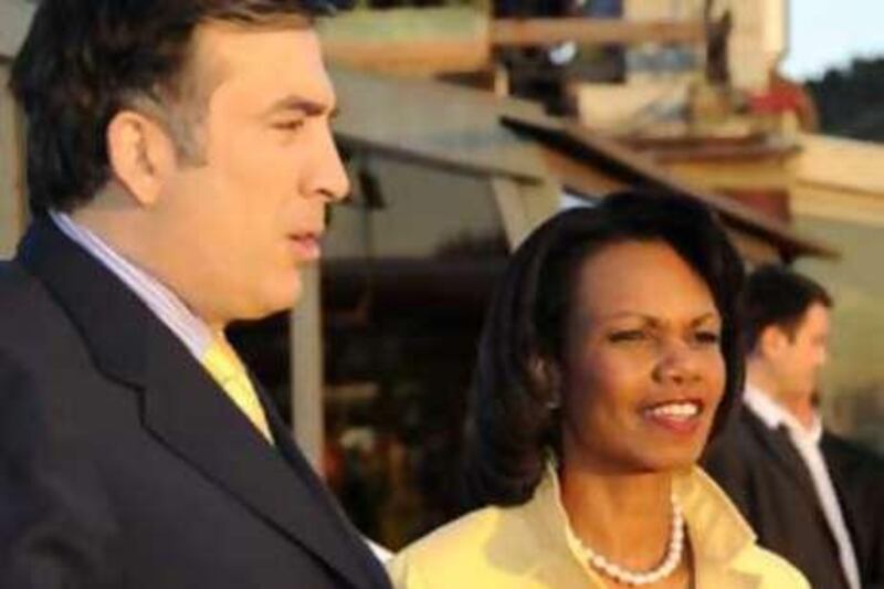 The Georgian President Mikhail Saakashvili speaks with the US Secretary of State Condoleezza Rice during their meeting in Tbilisi.
