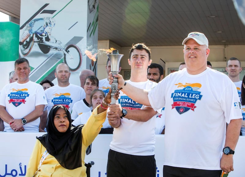 DUBAI, UNITED ARAB EMIRATES - The Special Olympics Torch being held by officials  at the Special Olympics Torch Run at Al Thiqah Club for Handicapped.  Leslie Pableo for The National