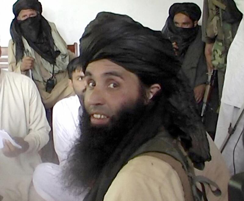 This frame grab taken November 11, 2013,from 2008 video footage shows Maulana Fazlullah, newly appointed chief of Tehreek-e-Taliban Pakistan (TTP), speaking with local journalists in the Pakistan's northwestern Swat valley. The Pakistani Taliban on November 7, 2013, have elected Maulana Fazlullah as their new chief following the death of the previous leader in a US drone strike. Fazlullah led the Taliban's brutal two-year rule in Pakistan's northwest valley of Swat in 2007-2009 before a military operation retook the area. AFP PHOTO / STR / AFP PHOTO / STR