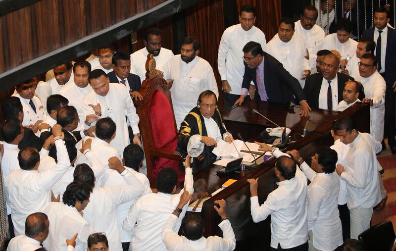 Sri Lanka's parliament members argue in front of the speaker Karu Jayasuriya during the parliament session in Colombo, Sri Lanka November 15, 2018. REUTERS/Stringer NO RESALES. NO ARCHIVES