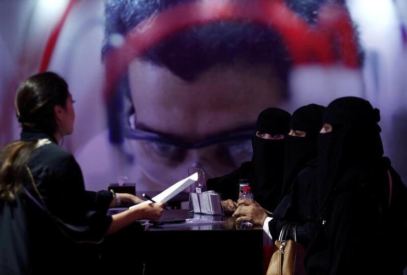 Saudi job seekers talk to a company representative at Glowork Women's Career Fair in Riyadh, Saudi Arabia October 2, 2018. REUTERS/Faisal Al Nasser