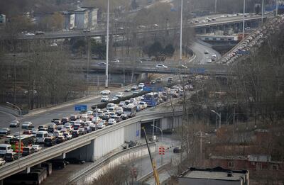 Cars move slowly on an elevated road on the first day of school in a traffic jam in Beijing, China, 25 February 2019.  (Imaginechina via AP Images)