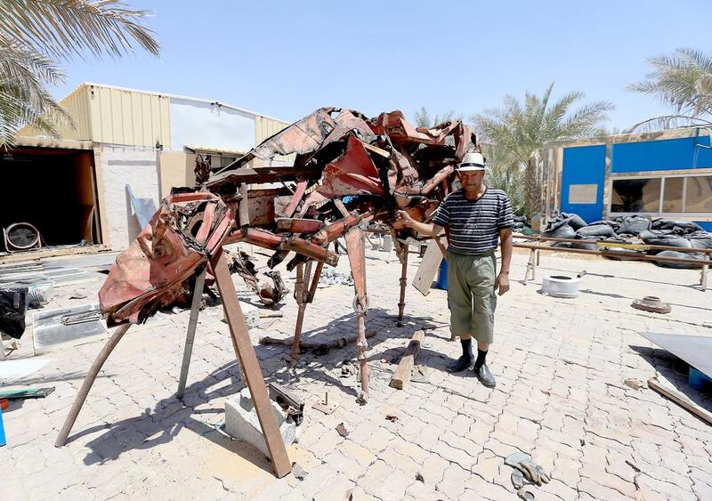 Mohammed al Sadoun resident artist from America with his Iron mural "red horse" made from scrap iron materials. Ravindranath L / The National 
