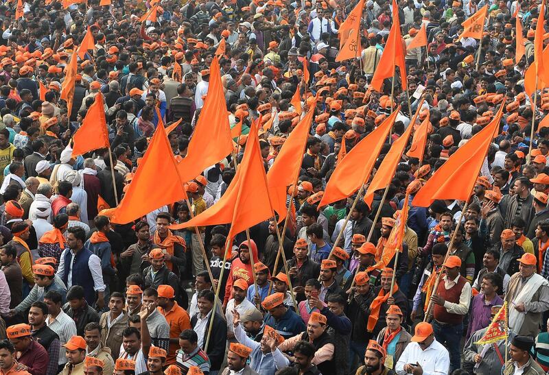 Indian Hindu hardliners participate in a rally calling for the construction of a temple on the site of the demolished 16th century Babri mosque, located in Ayodhya, in New Delhi on December 9, 2018. Tens of thousands of activists rallied on December 9 in the Indian capital on a call by a militant Hindu group demanding construction of a temple on the remains of a medieval mosque. / AFP / Sajjad HUSSAIN
