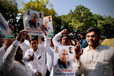 Congress supporters celebrate outside the residence of newly elected party president Mallikarjun Kharge in New Delhi, India, on Wednesday. AP