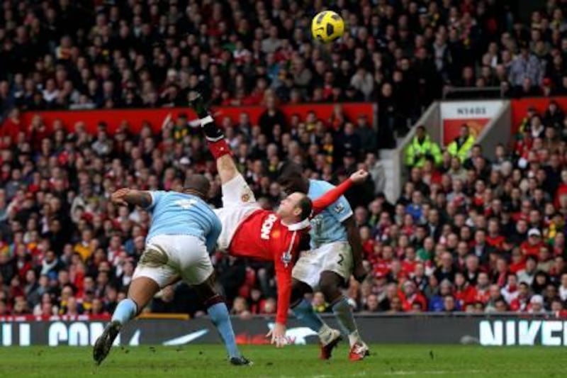 MANCHESTER, ENGLAND - FEBRUARY 12:  Wayne Rooney of Manchester United scores a goal from an overhead kick during the Barclays Premier League match between Manchester United and Manchester City at Old Trafford on February 12, 2011 in Manchester, England.  (Photo by Alex Livesey/Getty Images) *** Local Caption ***  GYI0063423542.jpg