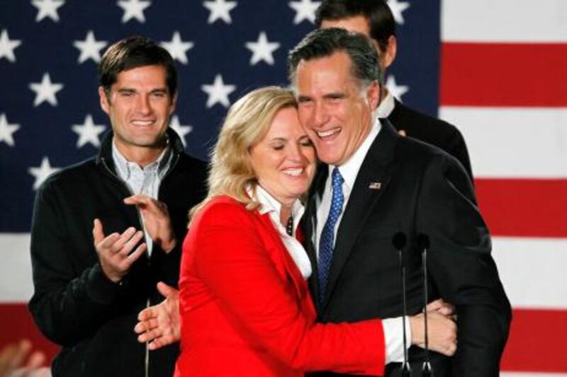 Republican presidential candidate and former Massachusetts Governor Mitt Romney hugs his wife Ann as he appeared at his Iowa Caucus night rally in Des Moines, Iowa, January 3, 2012. REUTERS/Rick Wilking (UNITED STATES - Tags: POLITICS ELECTIONS) *** Local Caption ***  DES101_USA-CAMPAIGN_0104_11.JPG