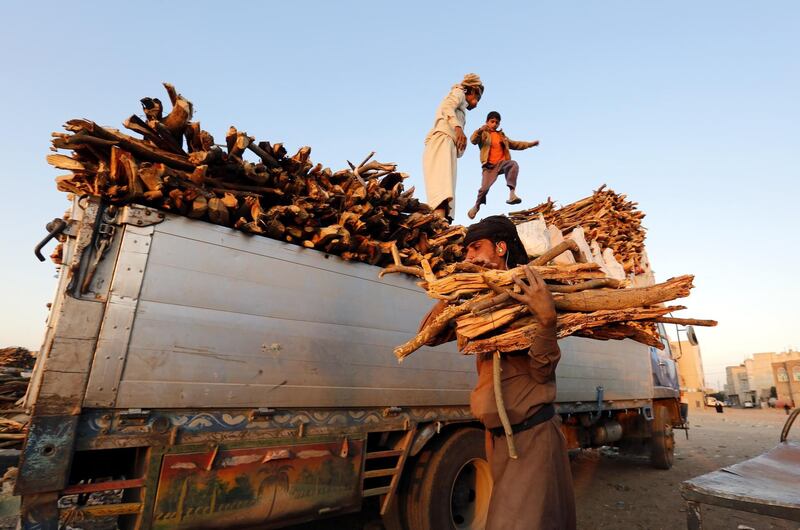 Yemeni vendors display firewood for sale amid a cooking gas shortage, at a firewood market in Sana'a, Yemen. EPA