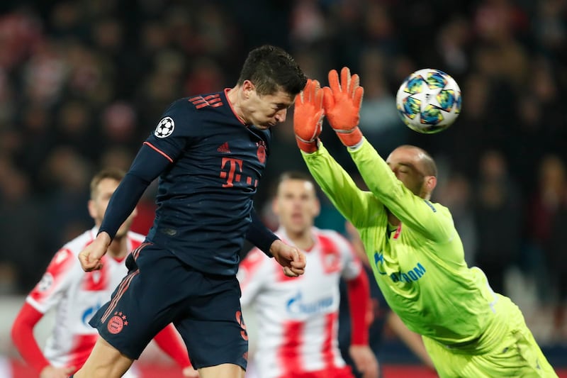 Robert Lewandowski heads home his third goal against Red Star. AP