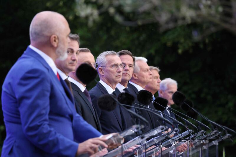 The leaders of Albania, Belgium, Poland, the Netherlands, Lithuania and Romania speak alongside Nato Secretary General Jens Stoltenberg, third left, in The Hague. AFP