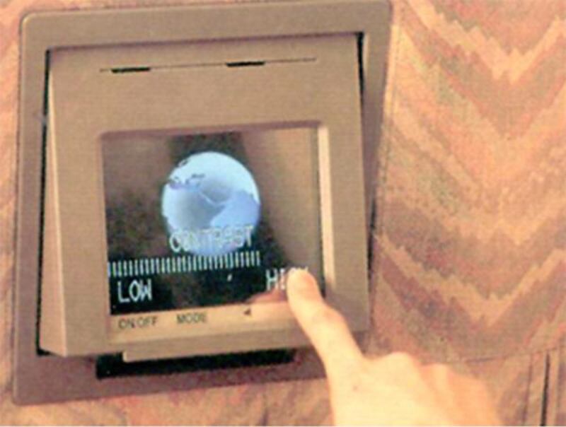 A passenger adjusts the video system. In 1996, Emirates took delivery of its first Boeing 777-200 and became the first airline to show live footage of take-off and landing on its in-flight entertainment system. Courtesy Emirates