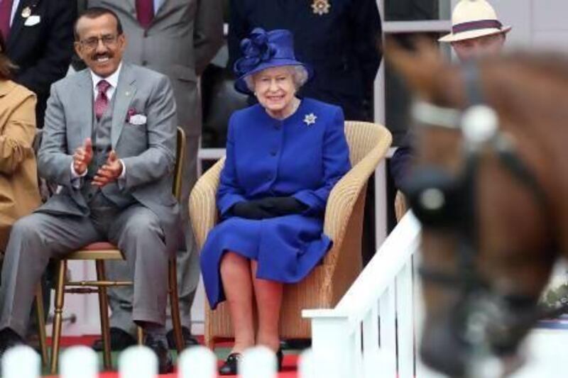 Khalaf Al Habtoor with Queen Elizabeth during Al Habtoor Royal Windsor Cup polo tournament, which he sponsors, at the Guards Polo Club near London. Stephen Lock for The National