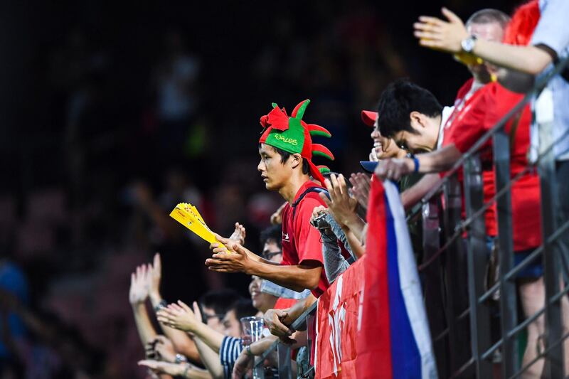 A Wales supporter celebrates victory after the match. AFP